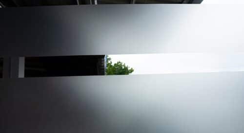 Frosted glass texture applied on toilet wall for stylish privacy and reduced visibility in modern homes